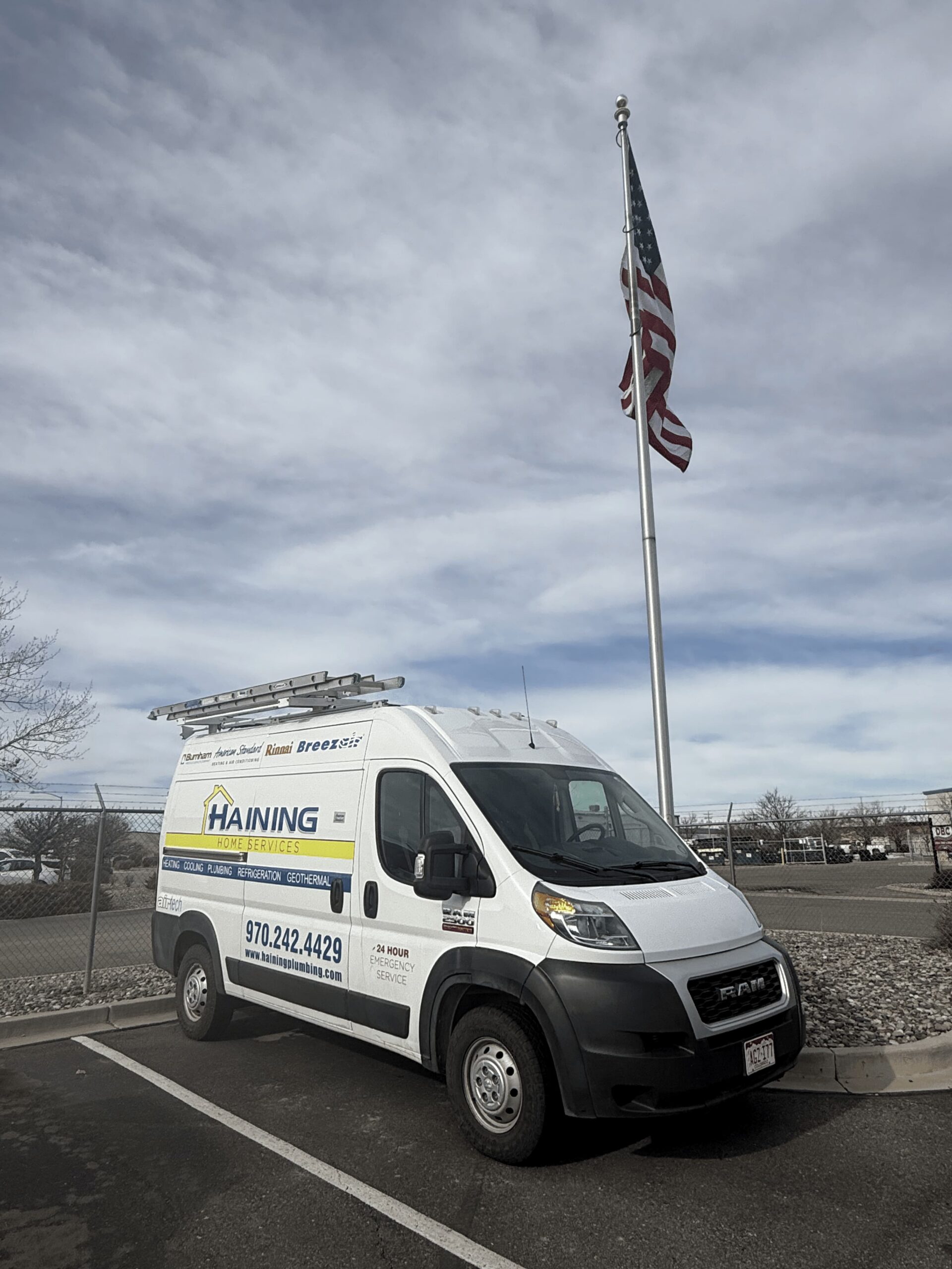 A Haining Home Services van with a flagpole behind it