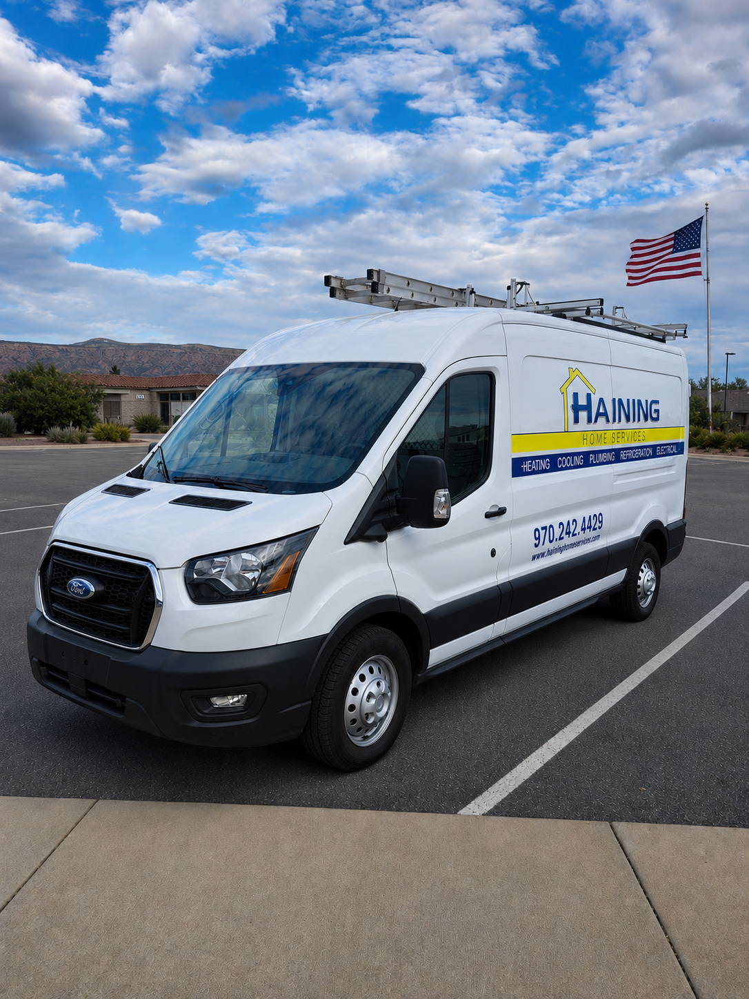 Haining Home Services van parked with mountain backdrop, offering heating, cooling, plumbing, and electrical services.
